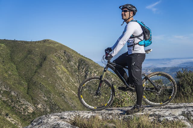 Man Riding a bicycle on a Mountain