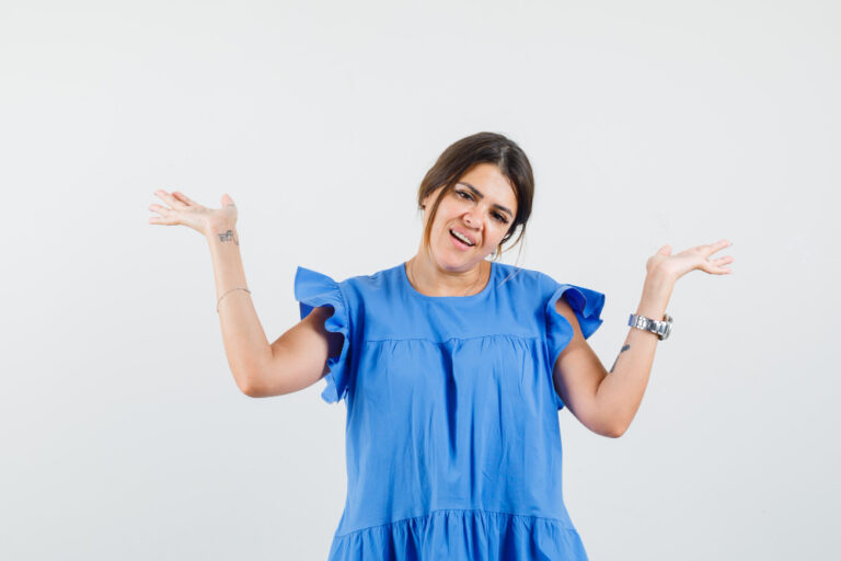 Young woman raising open palms