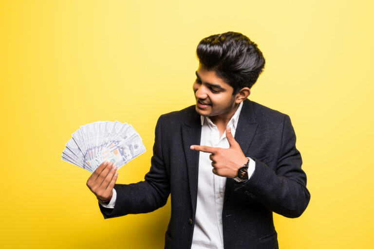 entrepreneur with dollar banknotes in hand classical suit with toothy smile