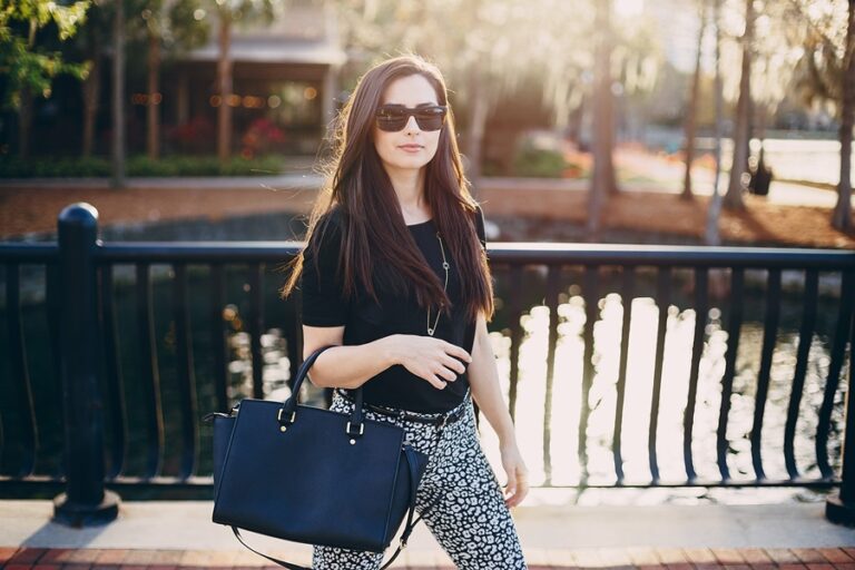 Beautiful girl with black stylish hand bag