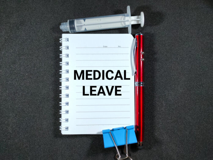 5150 MEDICAL LEAVE on notebook with syringe and pen