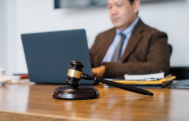 judge working on laptop in office