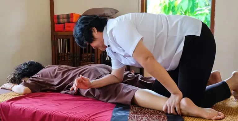 A man is doing Thai massage therapy