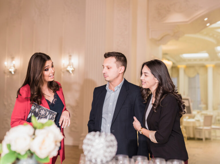 Event manager and couple talking